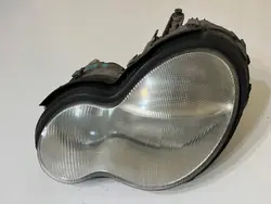 Mercedes C-klass W203 vänster framlykta OEM 2038200161