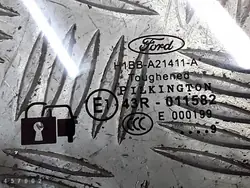 Ford Fiesta dörrglas OEM E143R011582 - Begagnad