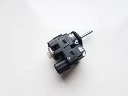 Motor ajustador faro Nissan OEM RUM34951