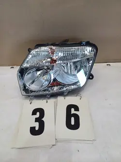 Vasen Etuvalaisin Dacia Duster I 260600069R