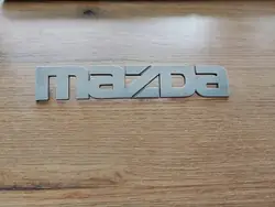 Emblème Hayon Mazda MPV OEM LC6351710 00-06