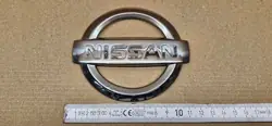 Emblème avant Nissan Micra K12 62890-AX-600