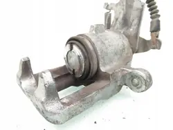 OEM ZACISK LEWY TYŁ NISSAN ALMERA II (N16) 1.5 - GA15DE