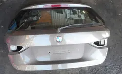 Tapa Maletero BMW X1 E84 OEM B06 SPARKLING BRONZE