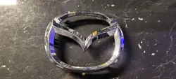 Emblema grade dianteira Mazda CX-3 OEM D10J51730