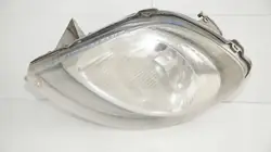 Farol dianteiro esquerdo Renault OE ORYGINAŁ Z DEMONTAŻU