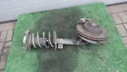 MCPERSON DÄMPARE FJÄDER VÄNSTER FRAM MERCEDES W212 A2123208738