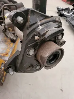 Soporte de pinza de freno Ford OE para eje trasero
