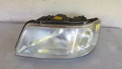 Farol dianteiro esquerdo VW T5 2003-2009