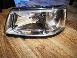 Farol dianteiro esquerdo VW T5