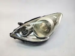 Vasen ajovalaisin Nissan Note 1 E11 Lift 09-14 OEM 26060BH10B