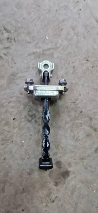 Limitador de puerta Nissan K14 delantero - OEM usado image 2