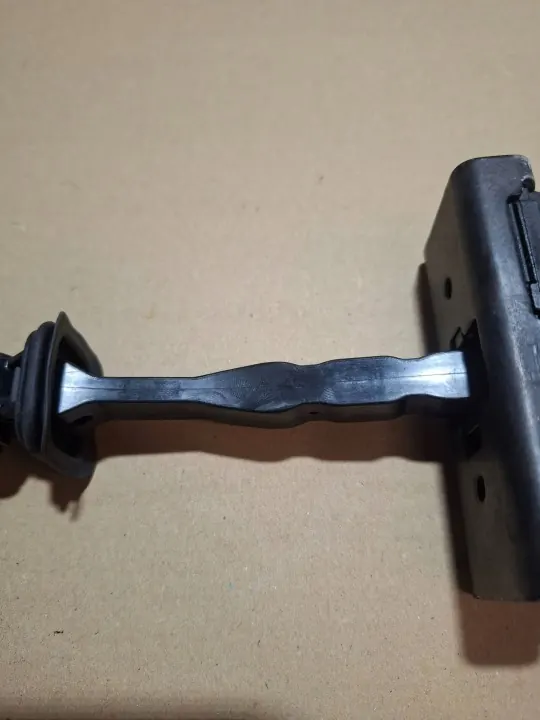 OEM 7C0837249A framdörrsöppningsbegränsare - Begagnad image 7