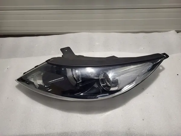 KIA Sportage III Lente del faro izquierdo 92101-3U210 image 6