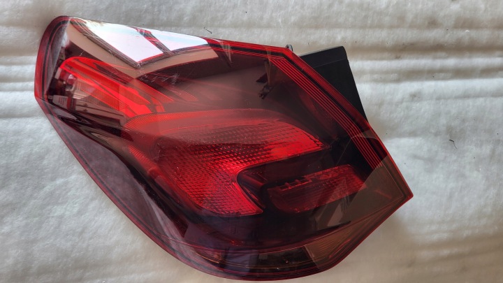 Left rear lamp bumper Opel Astra IV J 5D HB dark smoked 13319949