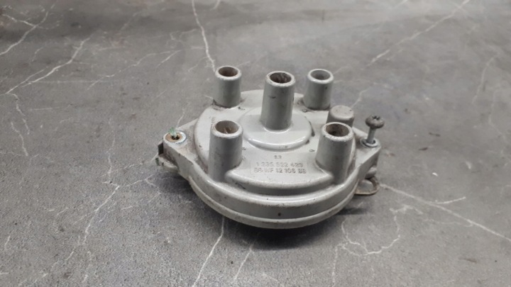 1235522423 Sytytyspuolan kansi FORD SIERRA