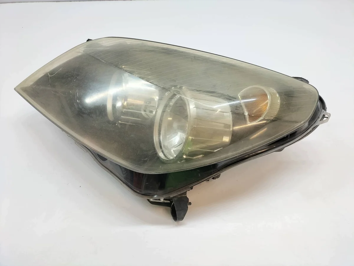 Vänster strålkastare Opel Astra III H (2004-2014)