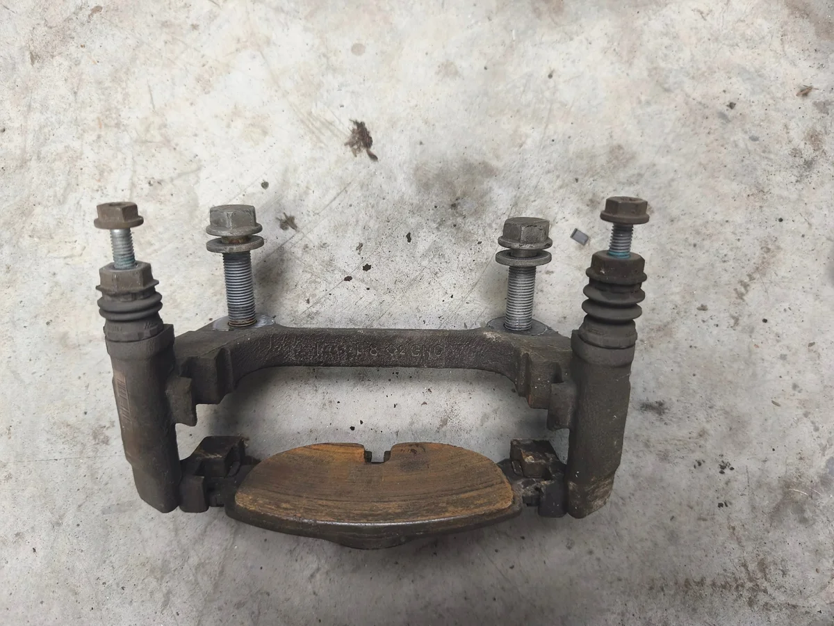 Brake Caliper Bracket VW Golf VII Right 5Q0615126A